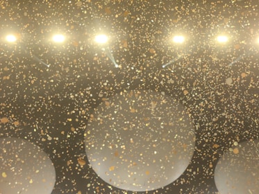 Excited players celebrating big wins with golden confetti in the Yang Mulia Wukong778 palace.