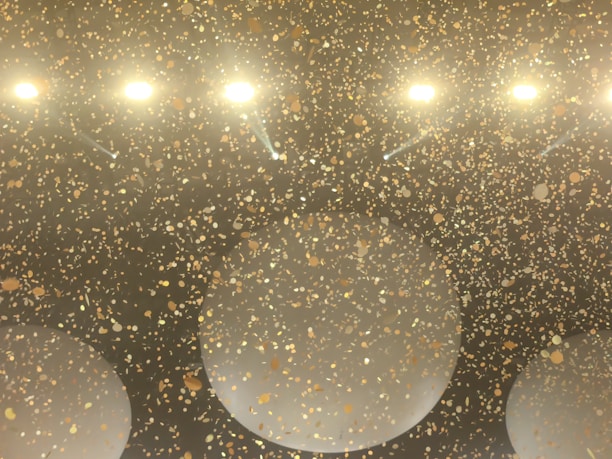 Close-up of vibrant prize money and celebratory confetti falling around.