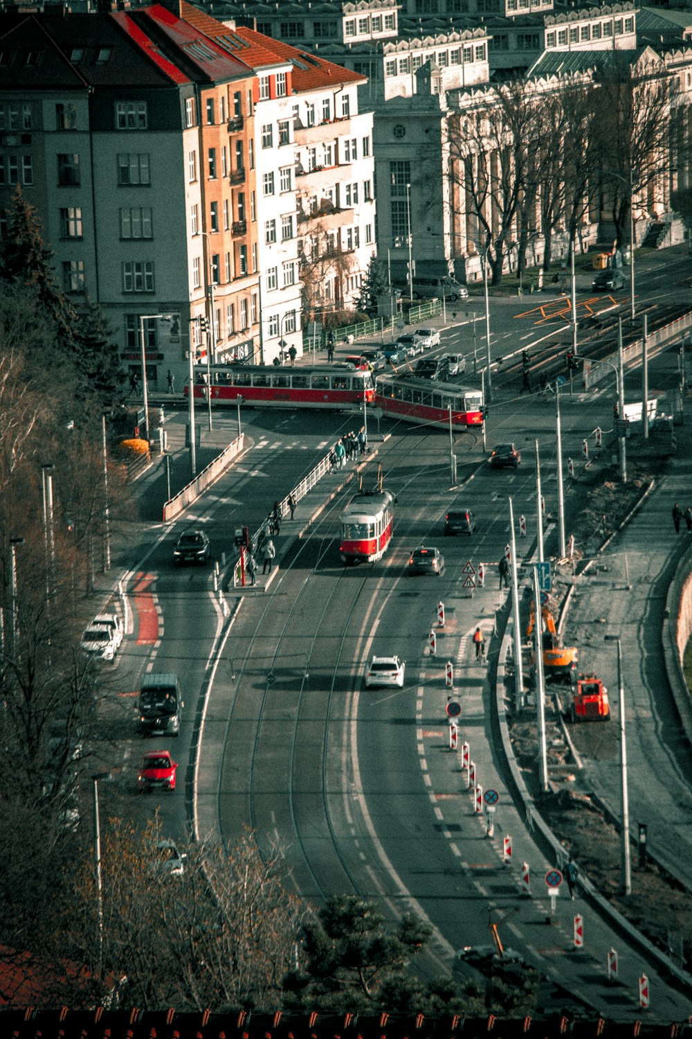 a city street filled with traffic next to tall buildings