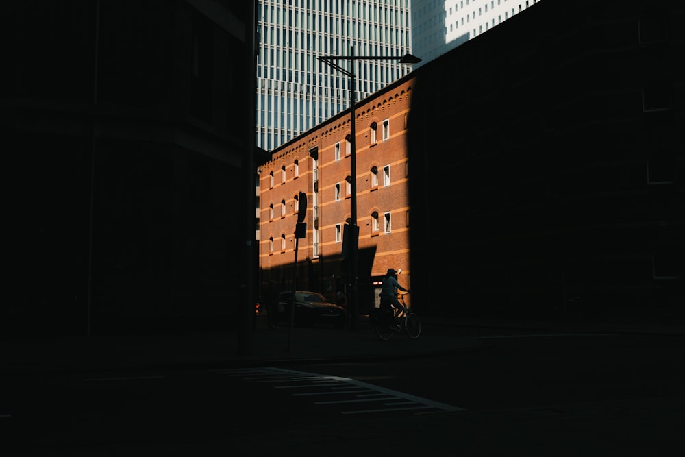 a tall building with a street light in the middle of it