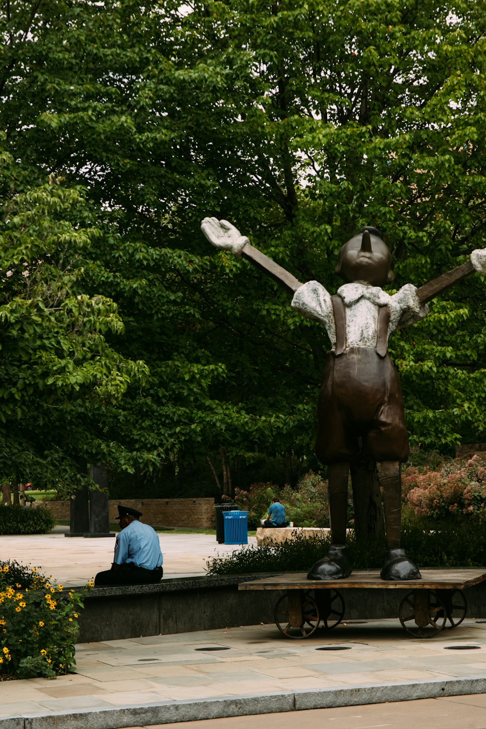 a statue of a person with arms outstretched