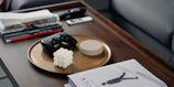 Compact smart coffee table with hidden storage and touch controls for lighting and speakers.
