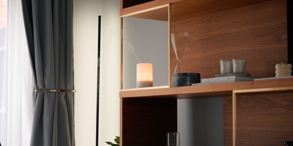 a living room with a book shelf and a window