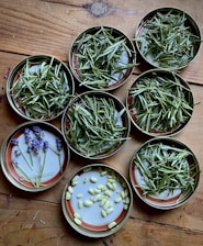 a table topped with bowls filled with plants