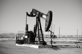 a black and white photo of an oil pump