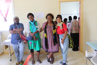A vibrant photo of the Solara Moda team smiling together inside their bright, welcoming store.