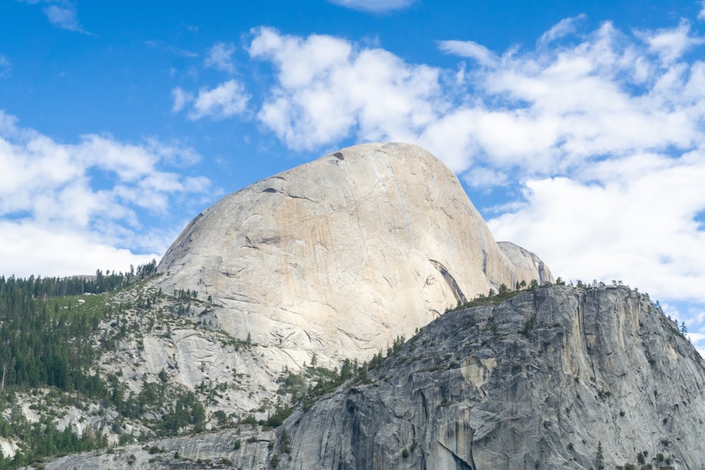 a mountain with a large rock in the middle of it