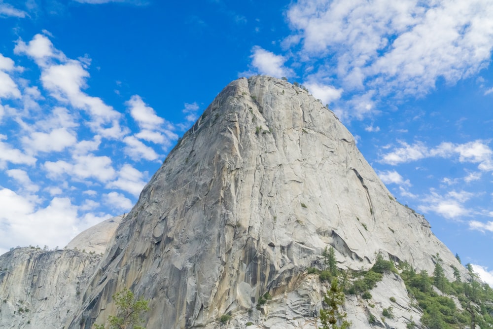 a very tall mountain with a sky background