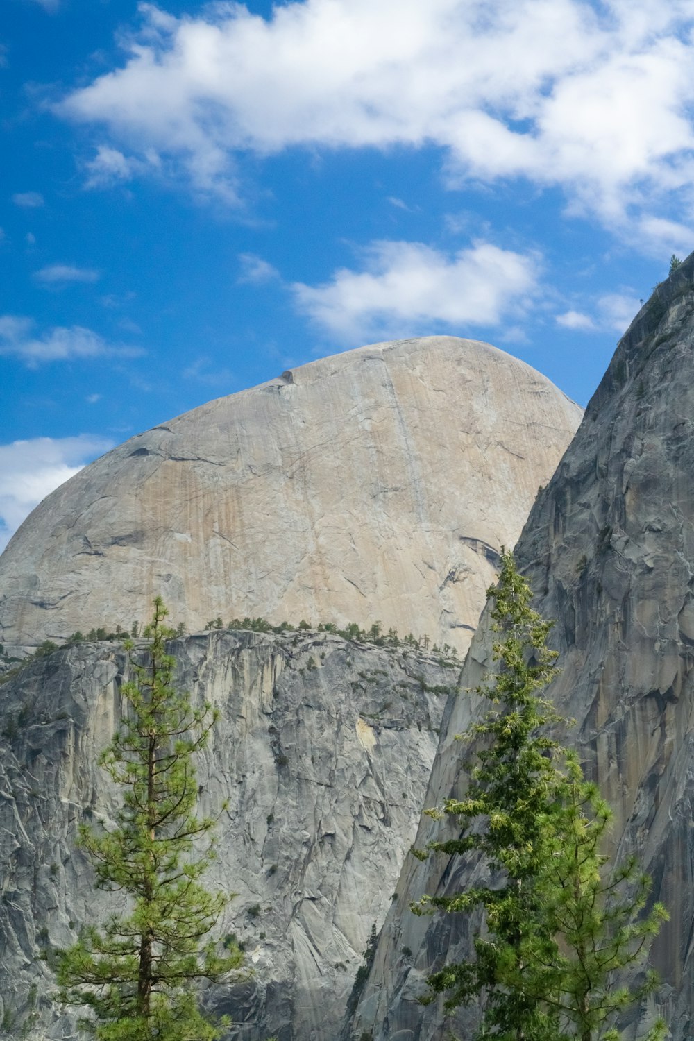 a mountain with a large rock in the background