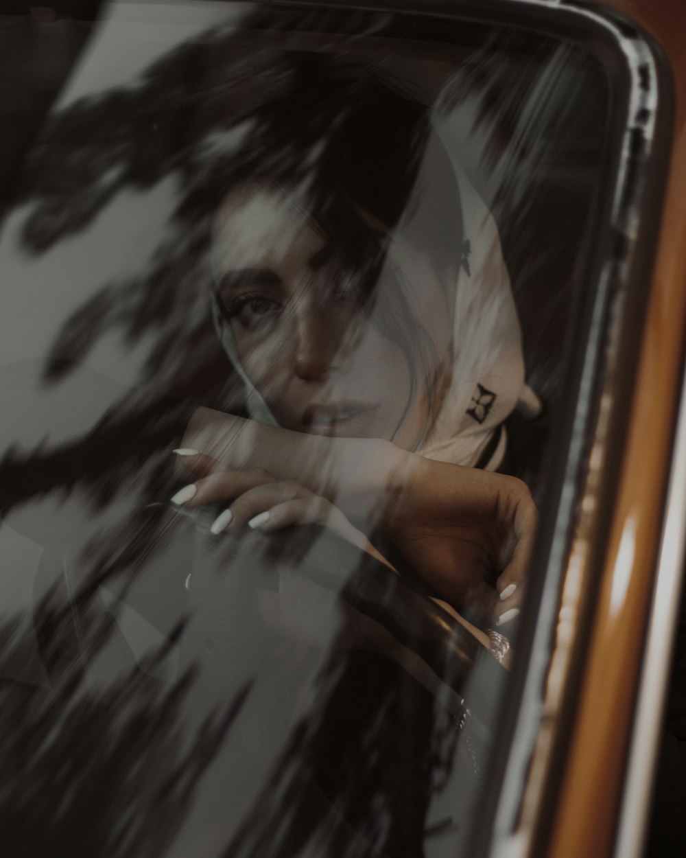 a woman looking out the window of a vehicle