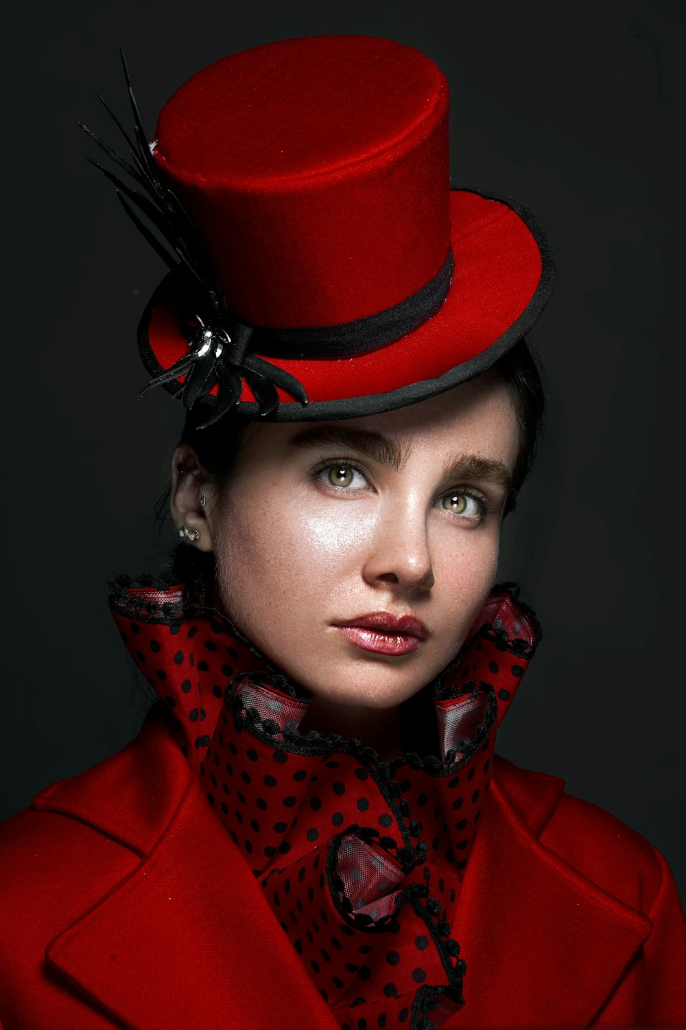 a woman wearing a red coat and a red hat