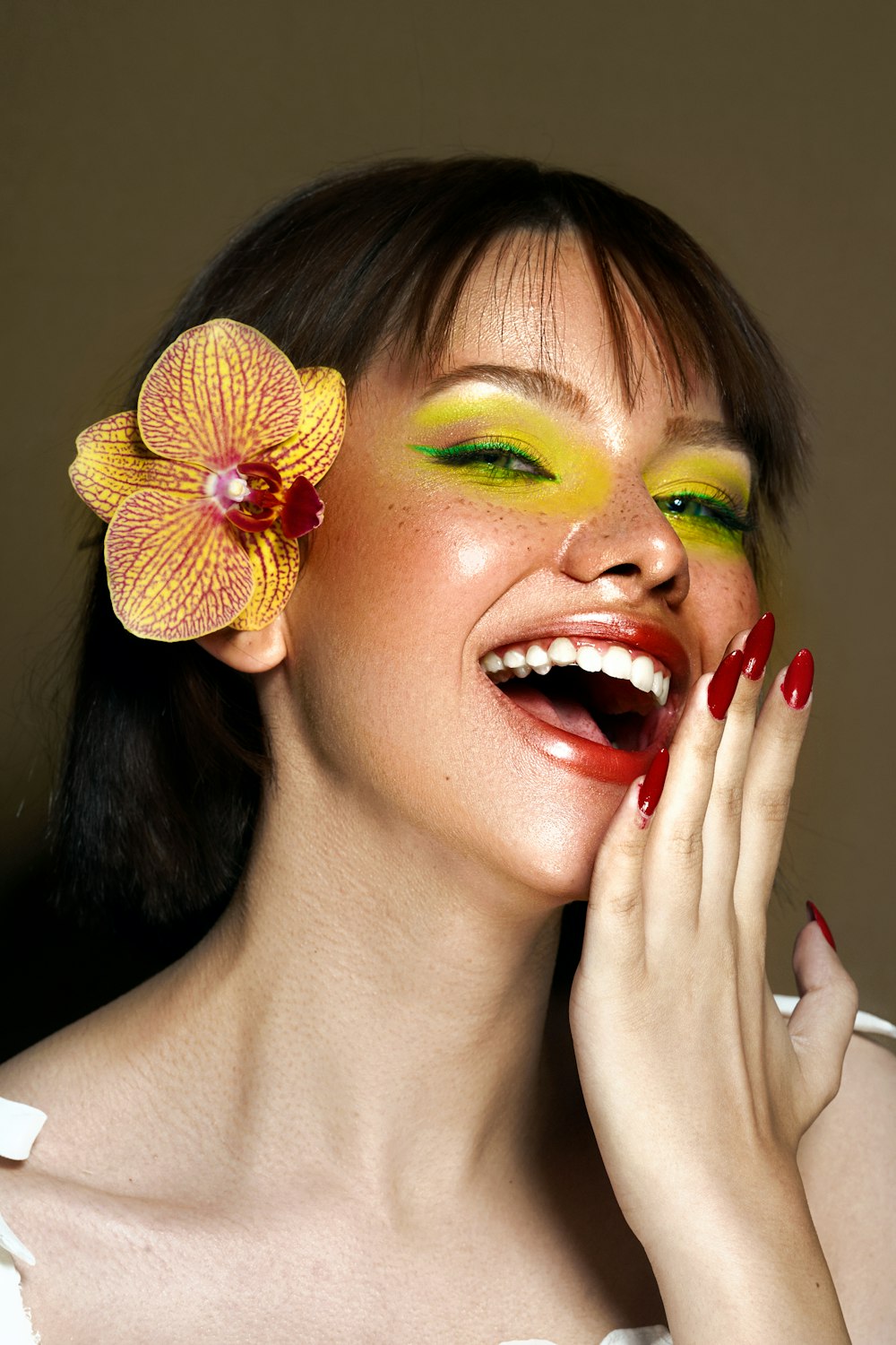 a woman with a flower in her hair