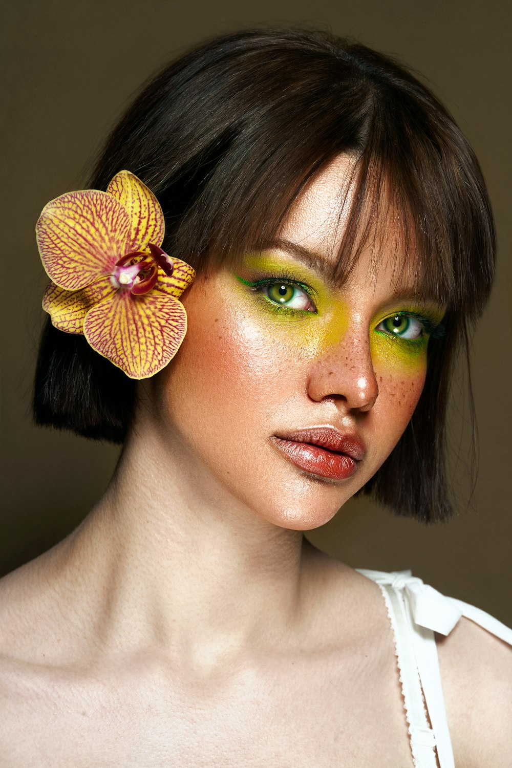 a woman with a flower in her hair