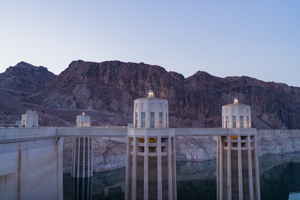 a couple of buildings that are next to a mountain