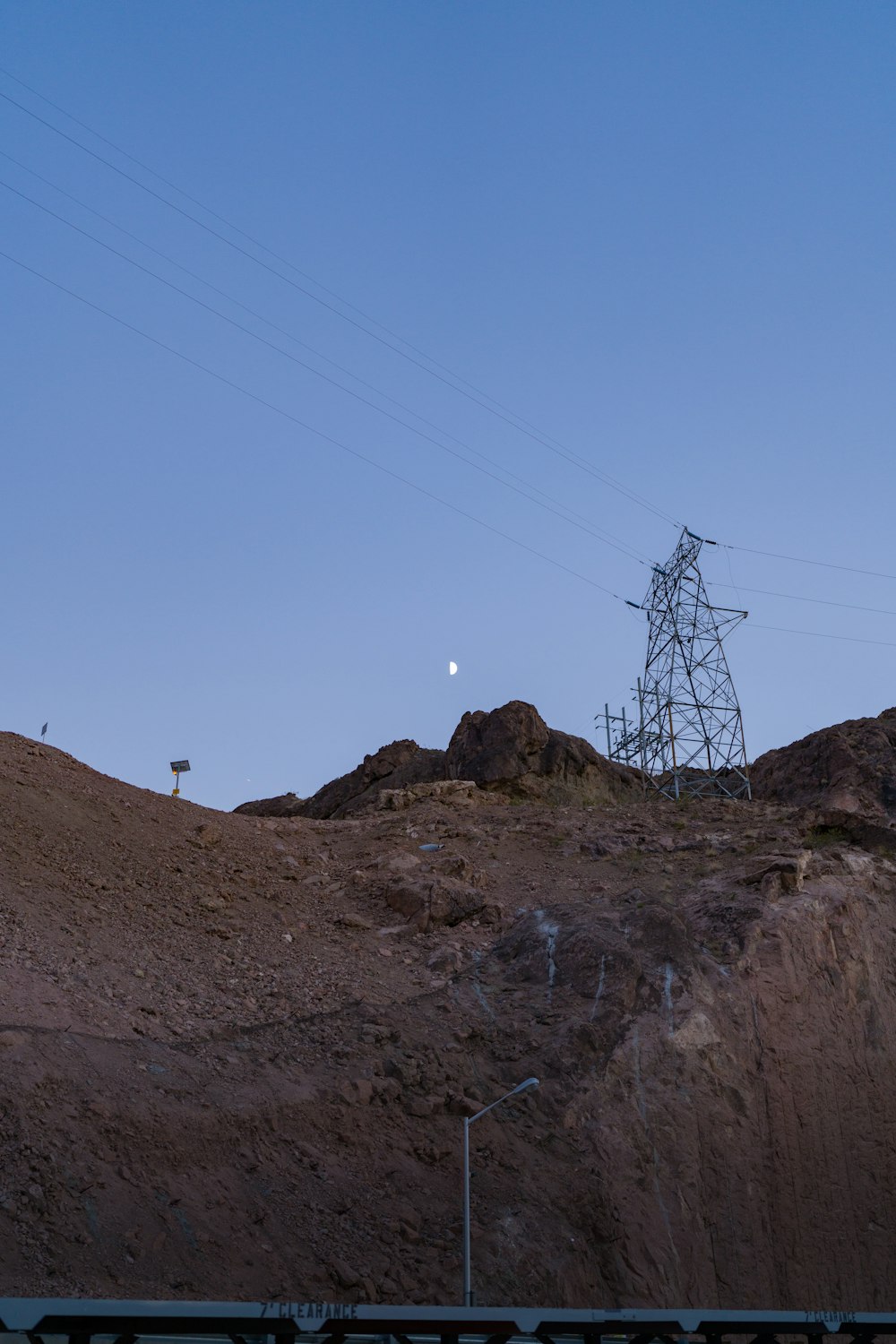 a hill with a power line in the distance