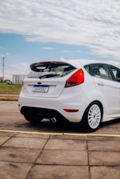 a white car parked in a parking lot