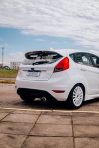 a white car parked in a parking lot