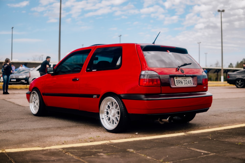 a red car parked in a parking lot