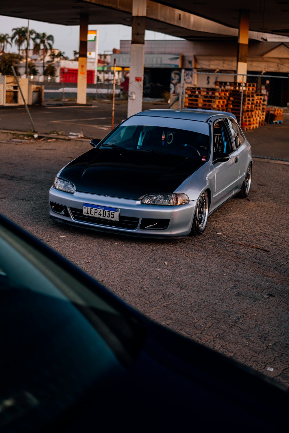 a silver car parked on the side of the road