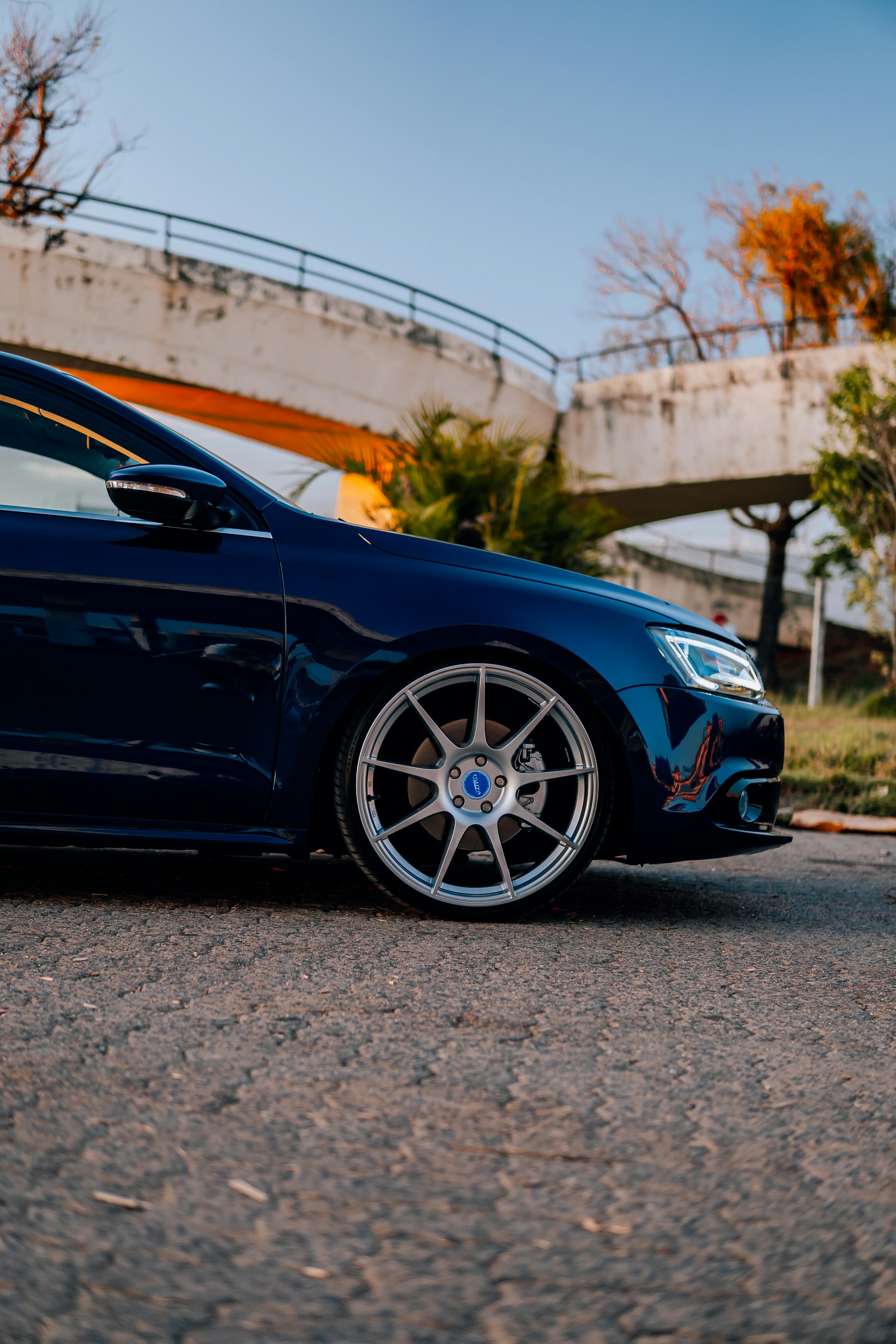 a blue car parked on the side of the road