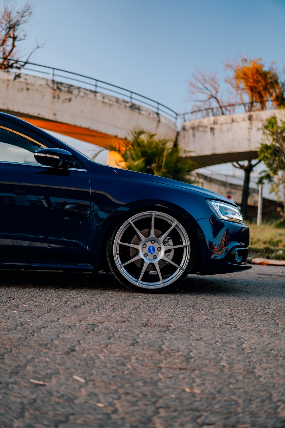 a blue car parked on the side of the road