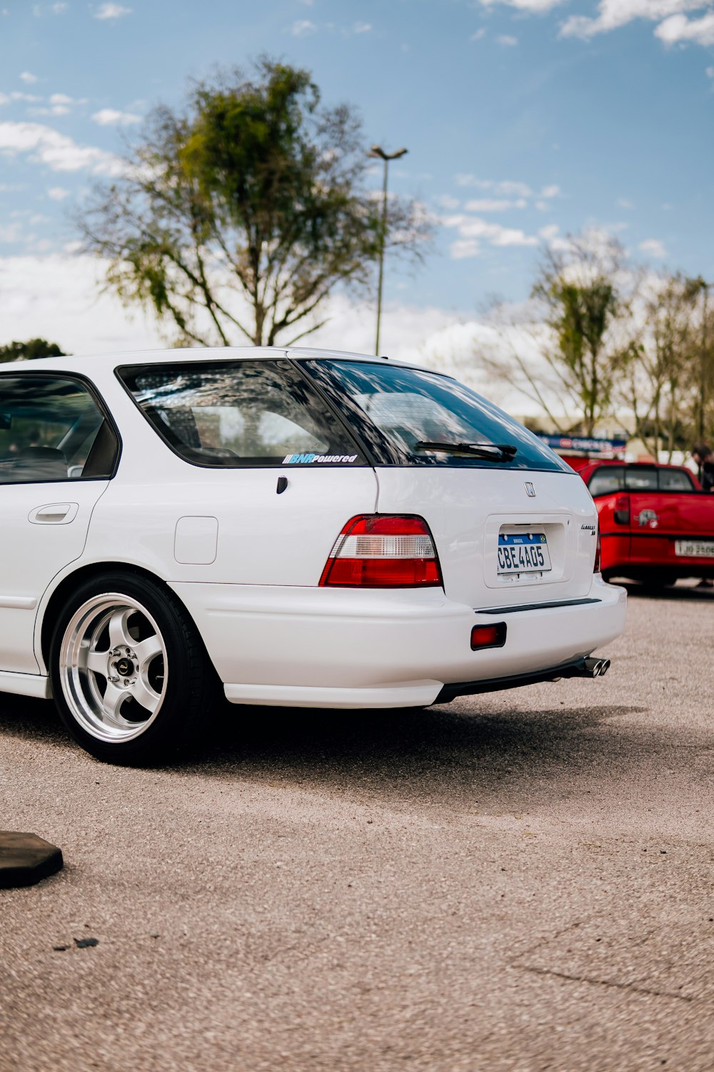 a white car parked in a parking lot