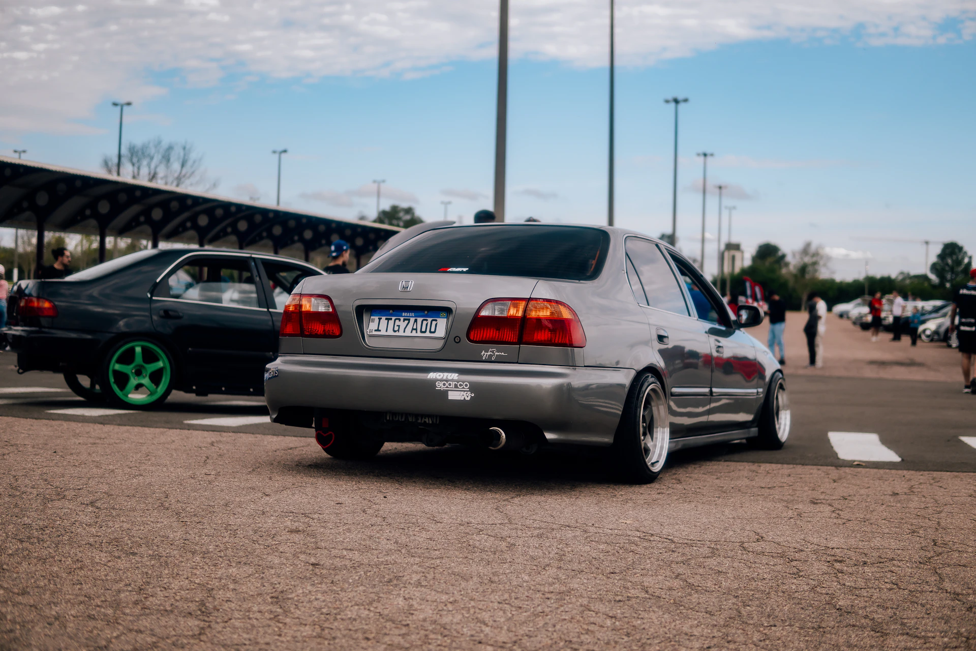 woman wearing yellow long-sleeved dress under white clouds and blue sky during daytime