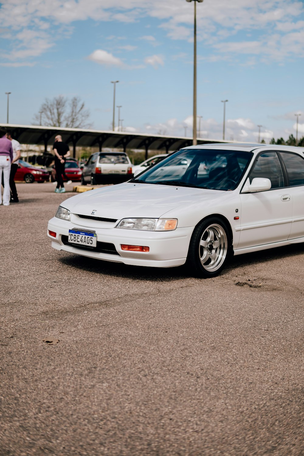 a white car parked in a parking lot