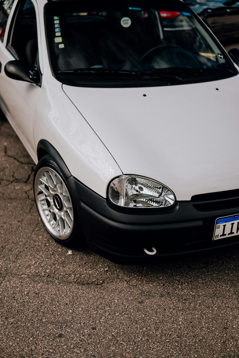 a white car parked in a parking lot