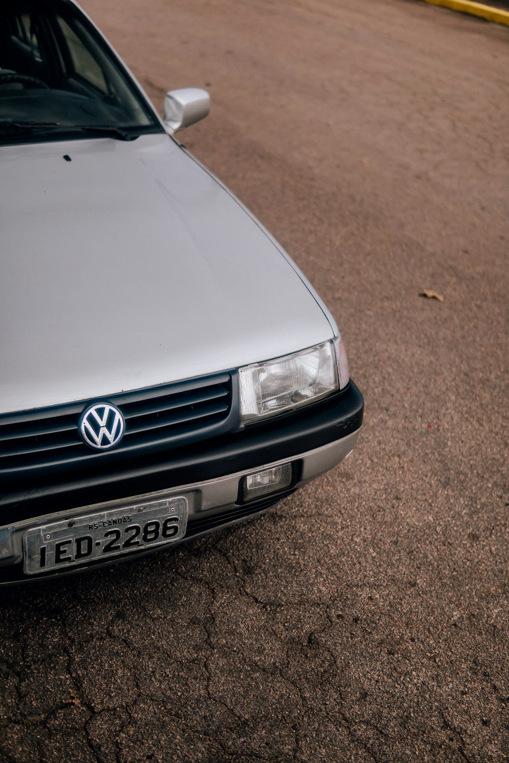 a silver car parked on the side of the road