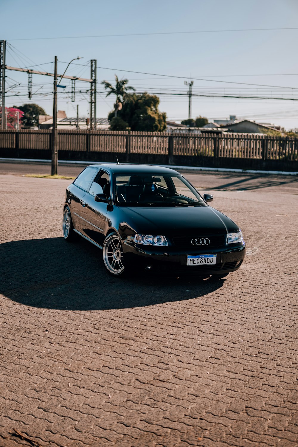 a black car parked in a parking lot