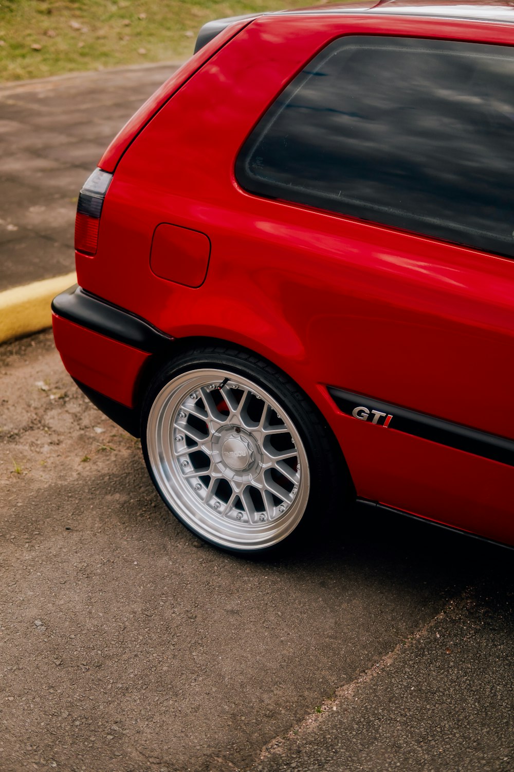 a red car parked in a parking lot