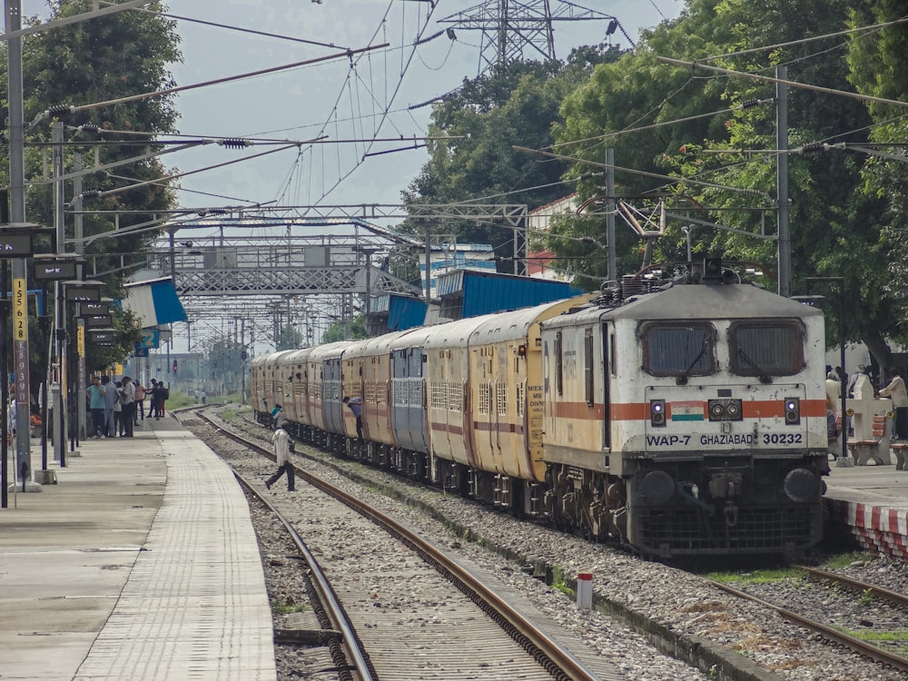 a train on a train track near a platform