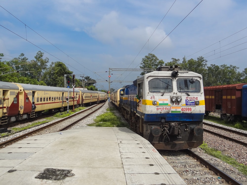 a couple of trains that are sitting on the tracks