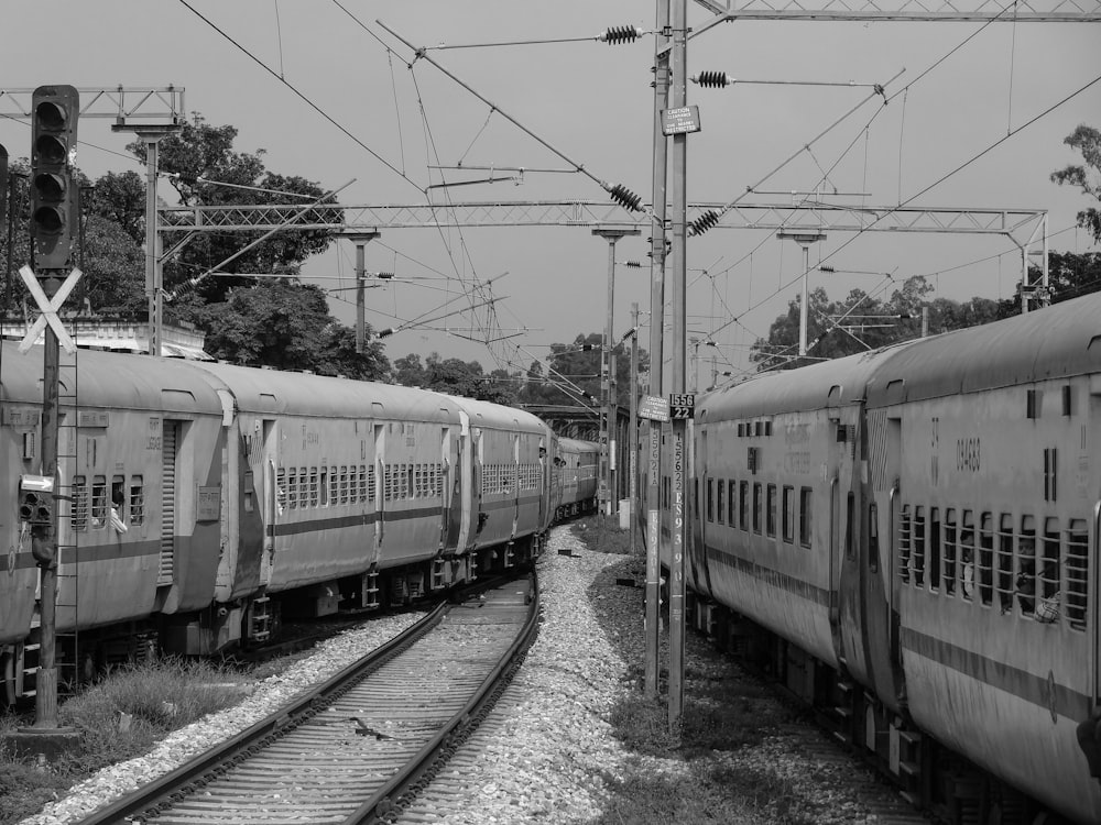 a couple of trains that are sitting on the tracks