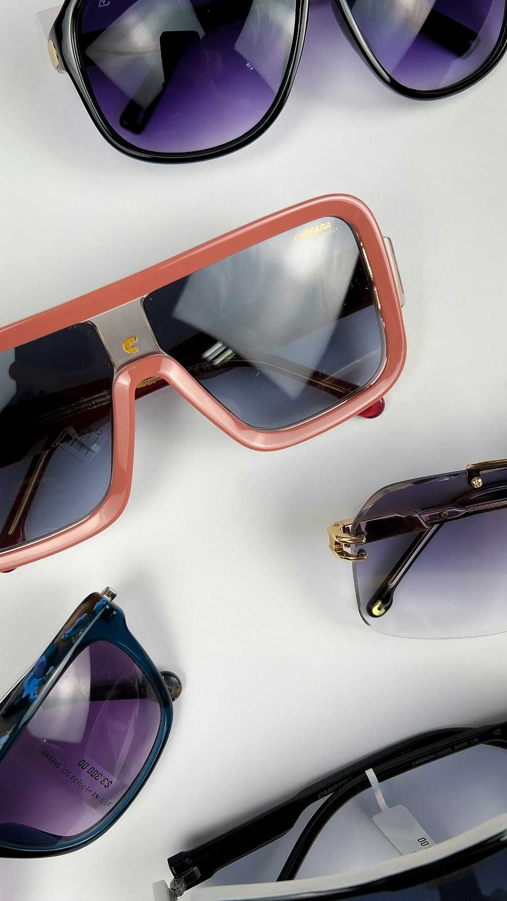 a group of sunglasses laying on top of each other