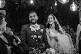 A joyful couple celebrating their wedding day surrounded by friends.