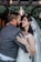 A close-up of a bride and groom sharing a joyful moment during their wedding ceremony.