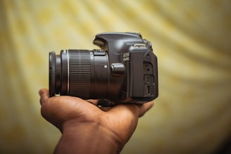 a person holding a camera in their hand