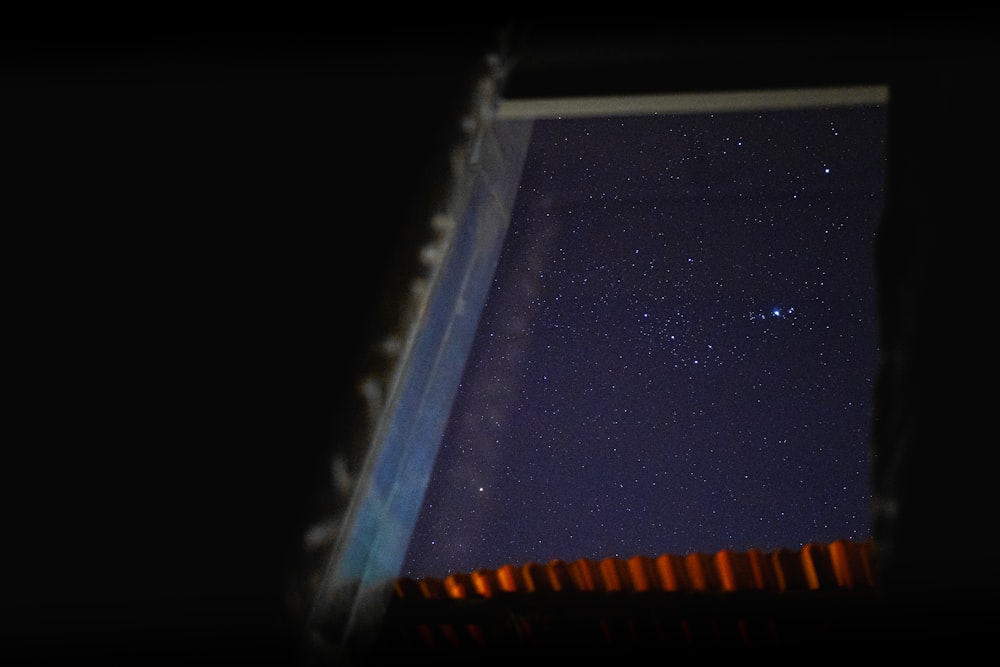 a view of the night sky from a window