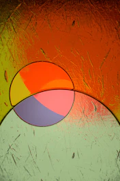 a painting of a circular object on a wall
