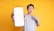 A happy customer giving a thumbs up while holding a new mobile phone.