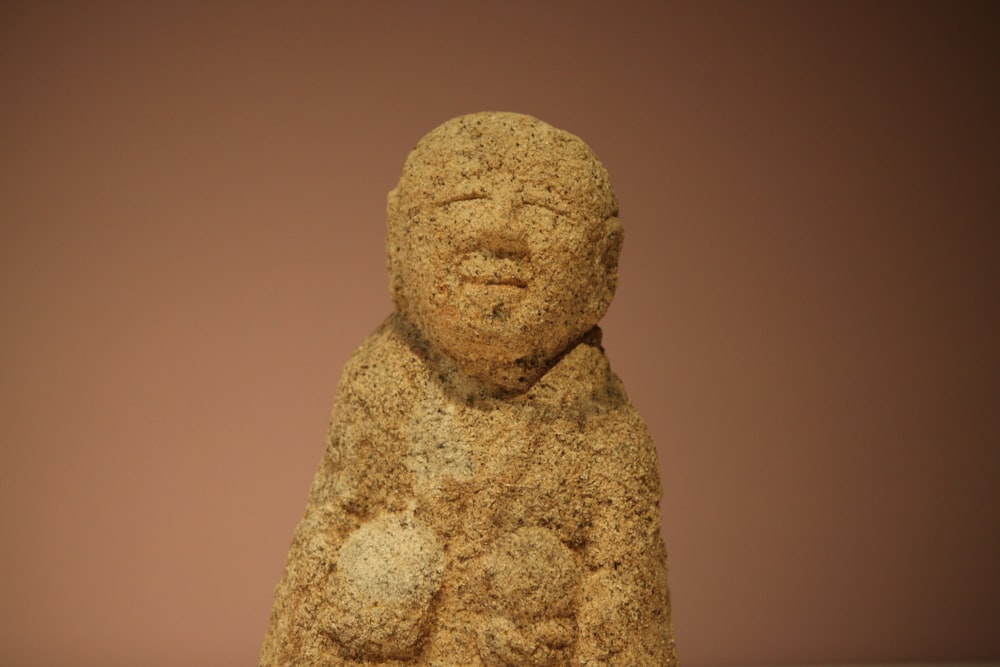 a statue of a person made of sand