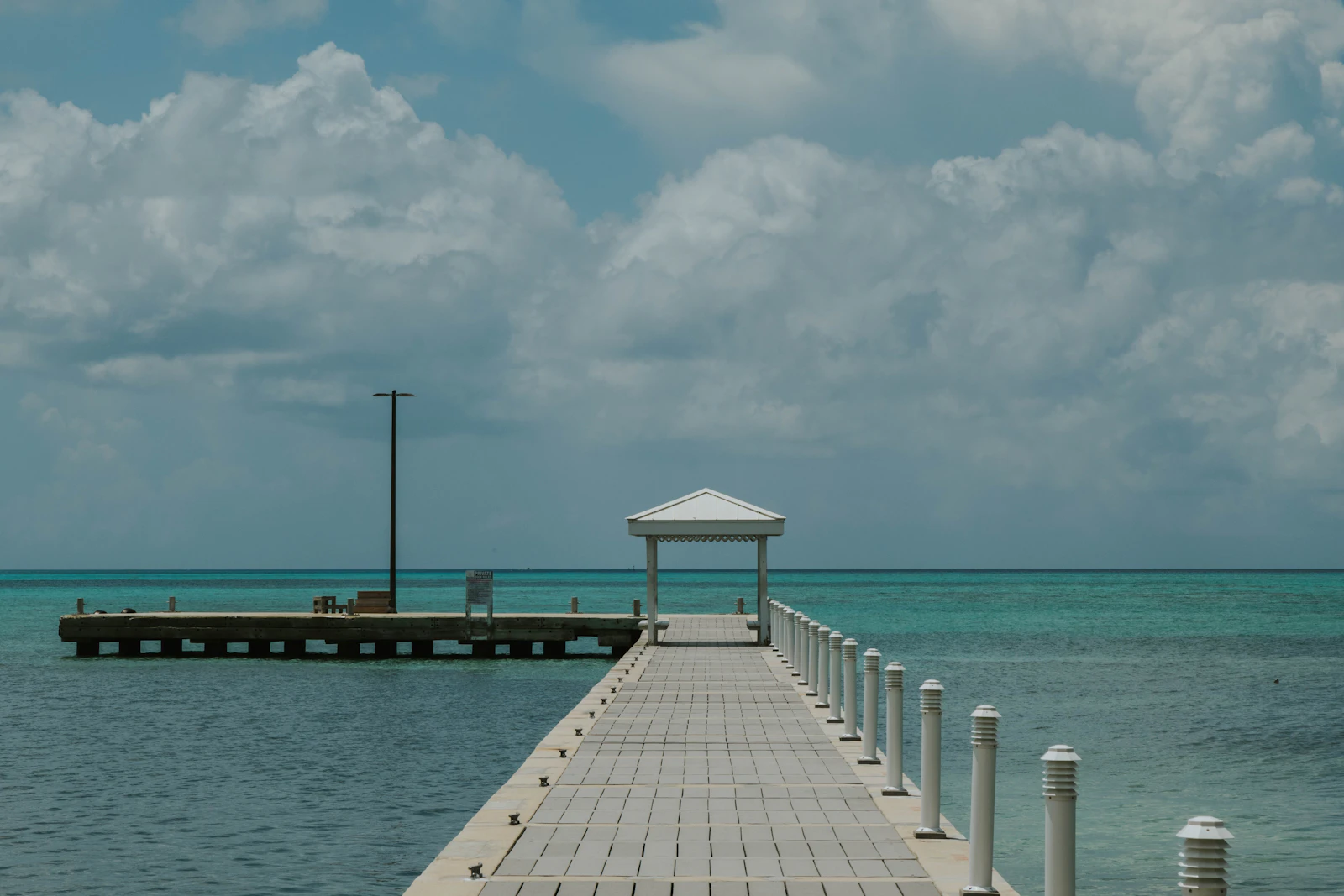 Pier and gazebo at Rum Point, Grand Cayman, with turquoise water