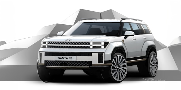 a white suv parked in front of a mountain