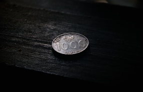 a close up of a coin on a table