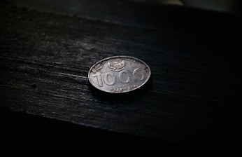 a close up of a coin on a table