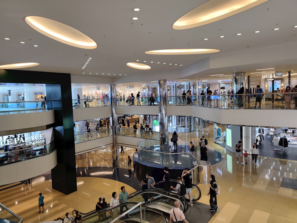 a mall filled with lots of people walking around