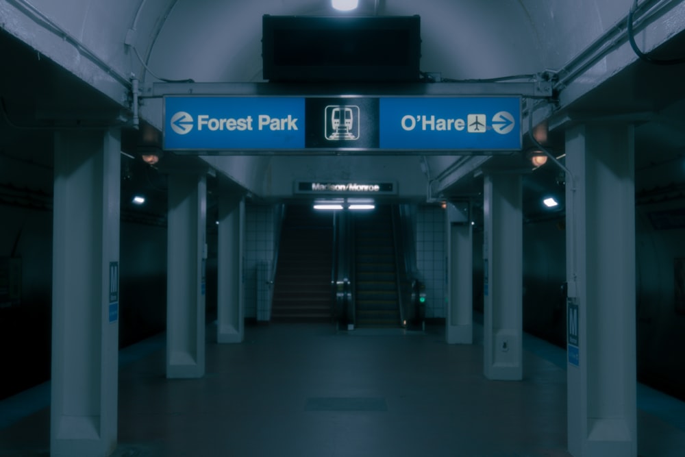 a long hallway with a sign that says forest park
