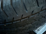 Close-up of a rugged tire tread showing durable design.